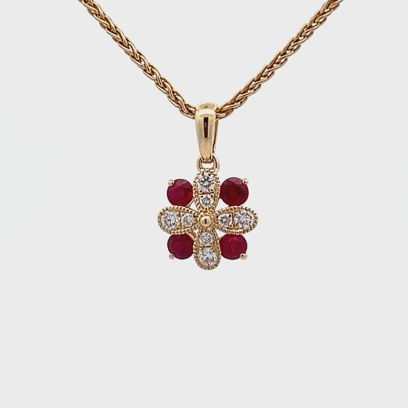 14k Yellow Gold Round Ruby and Diamond Flower Pendant (0.30ctw)