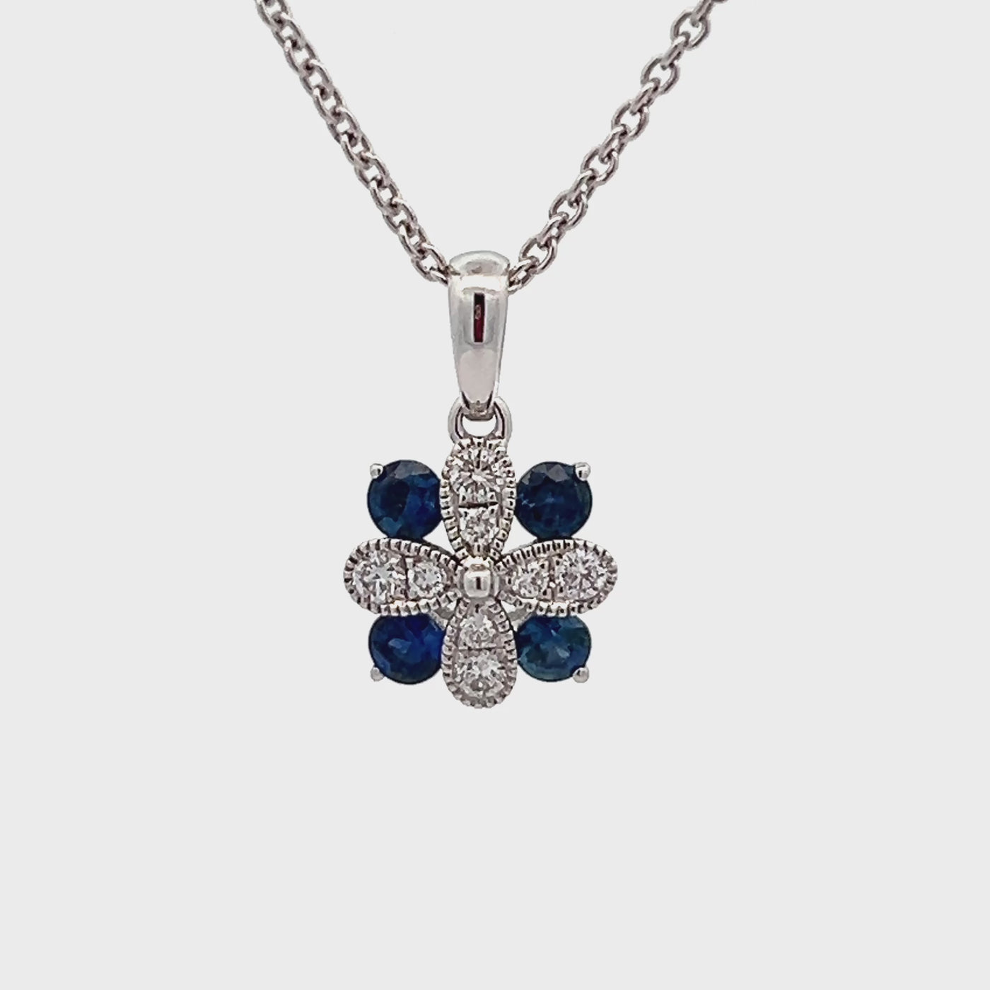 14k White Gold Round Sapphire and Diamond Flower Pendant (0.32ctw.)