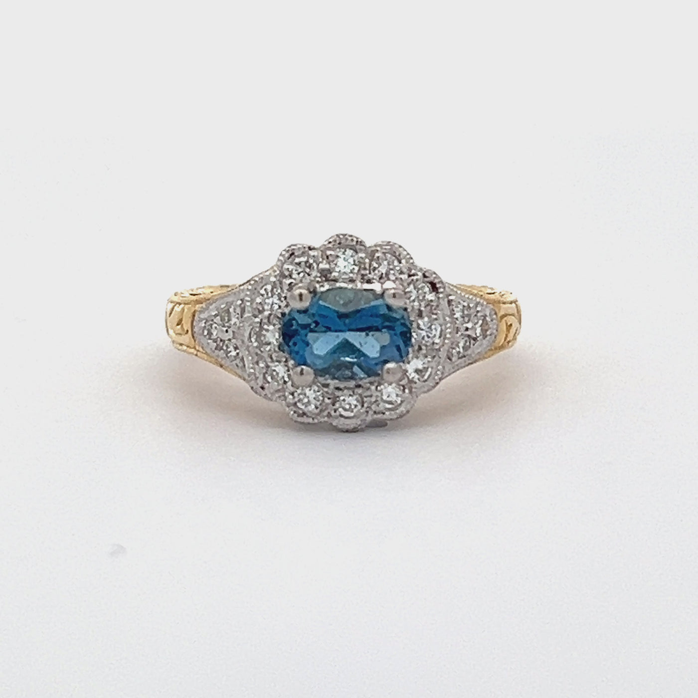 18k Yellow Gold and Platinum Oval Aquamarine and Round Diamond Halo Ring (0.68ctw.)