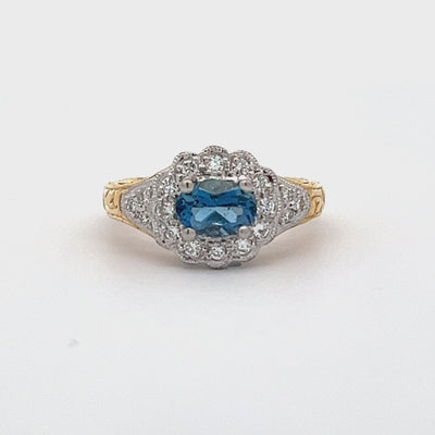 18k Yellow Gold and Platinum Oval Aquamarine and Round Diamond Halo Ring (0.68ctw.)