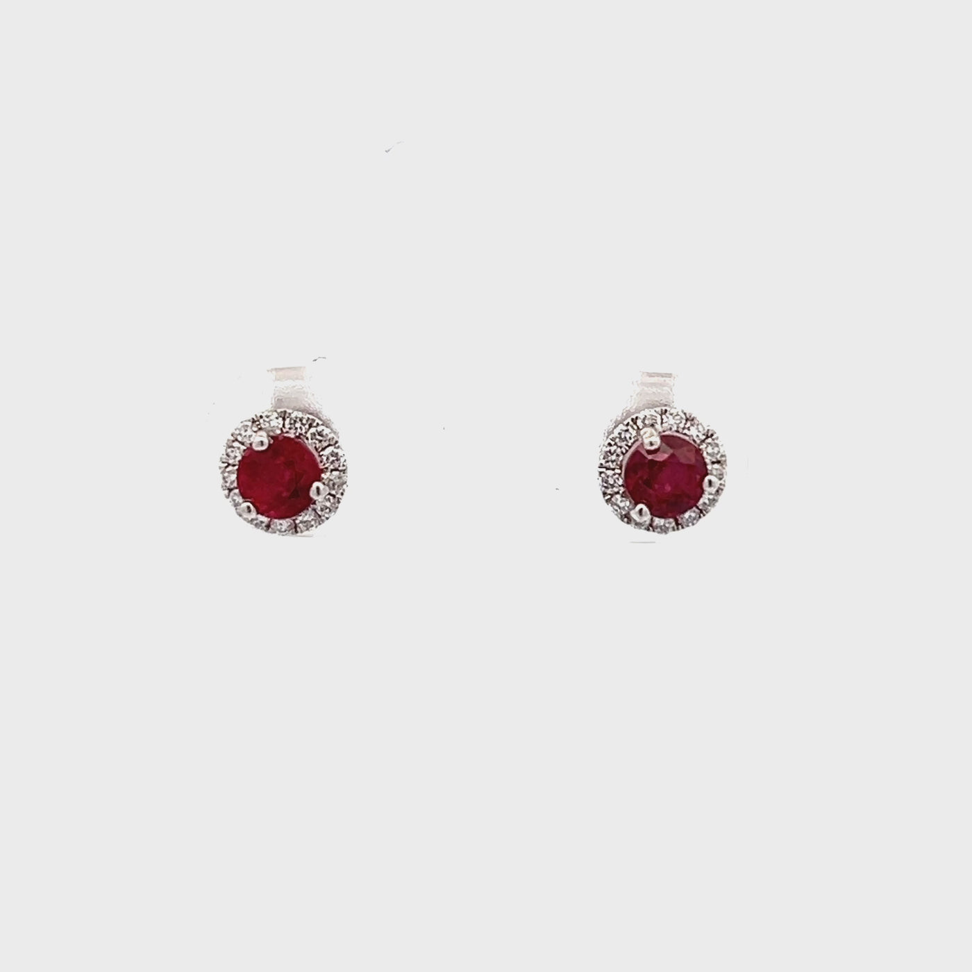 14k White Gold Round Ruby and Diamond Halo Earrings (0.69ctw.)