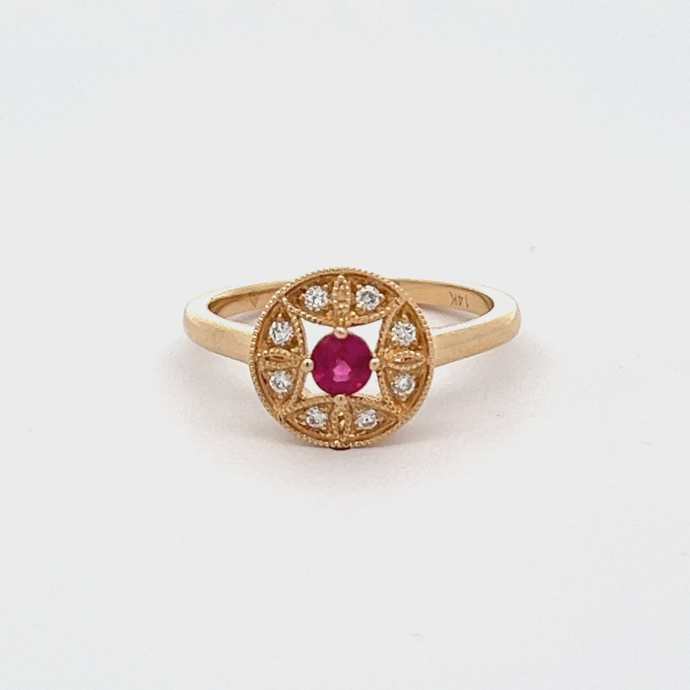 14k Yellow Gold Round Ruby and Diamond Halo Ring (0.34ct.)
