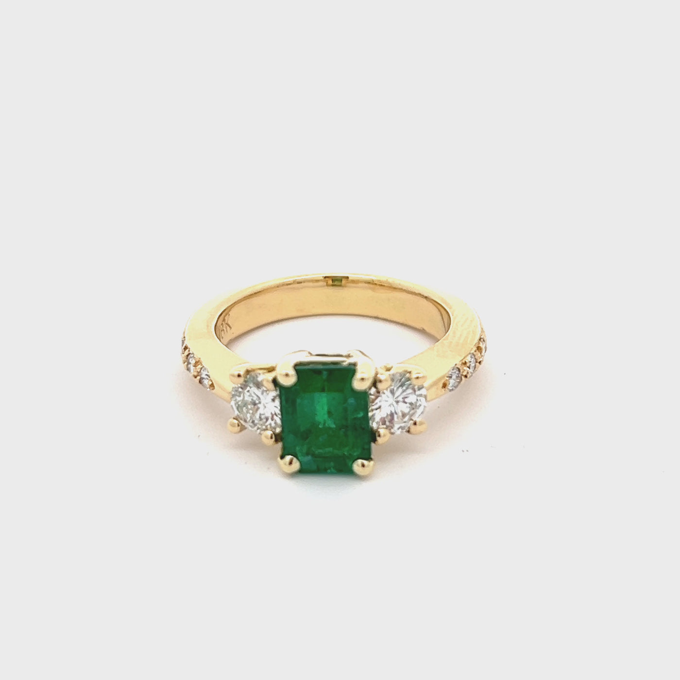 18k Yellow Gold Emerald Cut Emerald and Round Diamond Three Stone Ring (1.43ct.)
