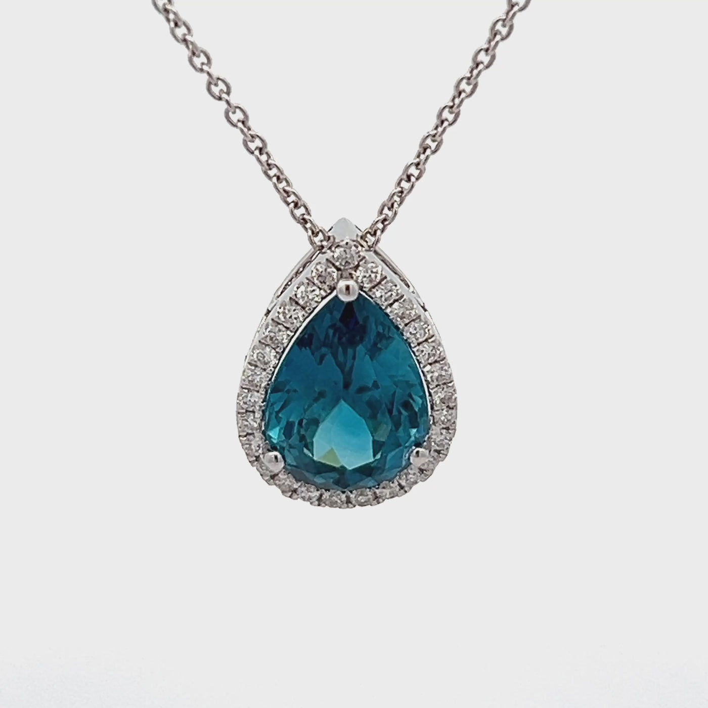 18k White Gold Pear Shape Blue Zircon and Round Diamond Halo Pendant (5.66ct.)