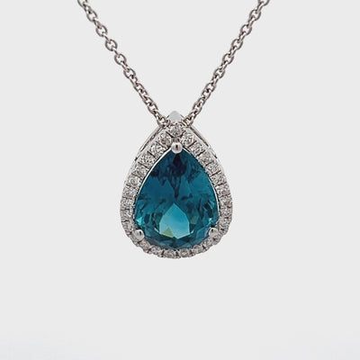 18k White Gold Pear Shape Blue Zircon and Round Diamond Halo Pendant (5.66ct.)