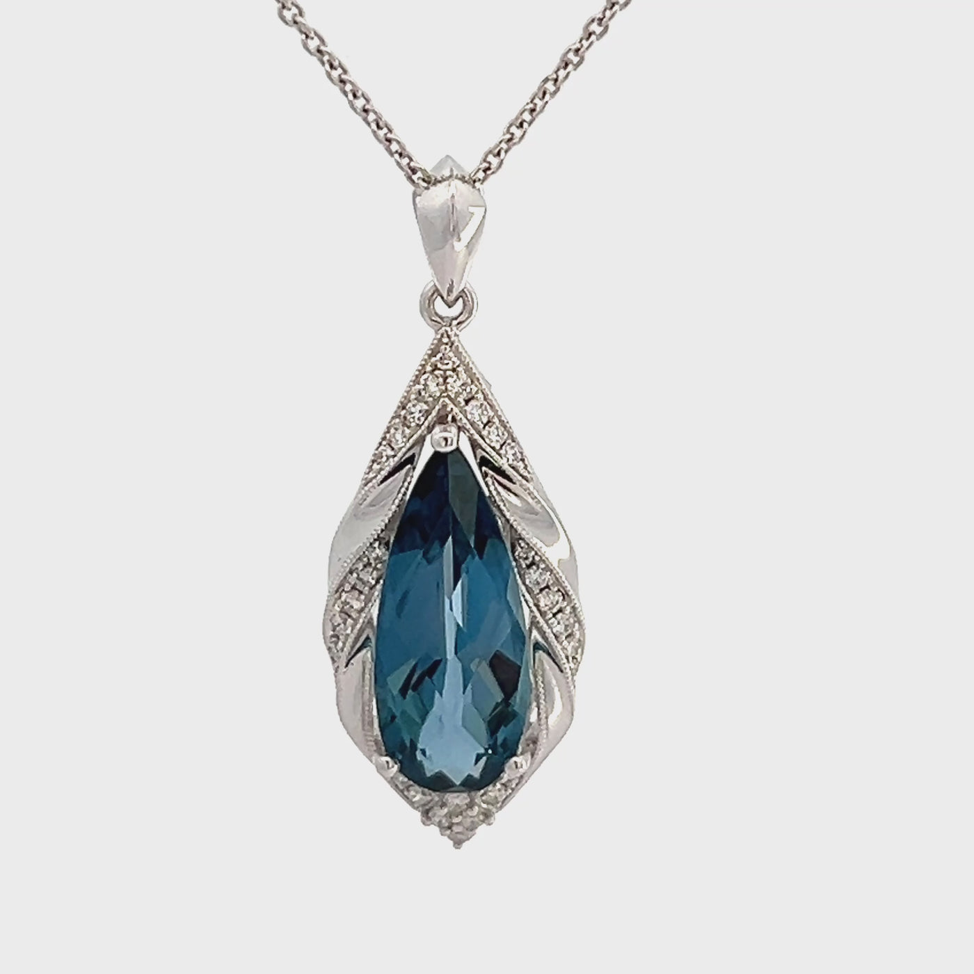 14k White Gold Pear Shape London Blue Topaz and Round Diamond Halo Pendant (4.57ct.)