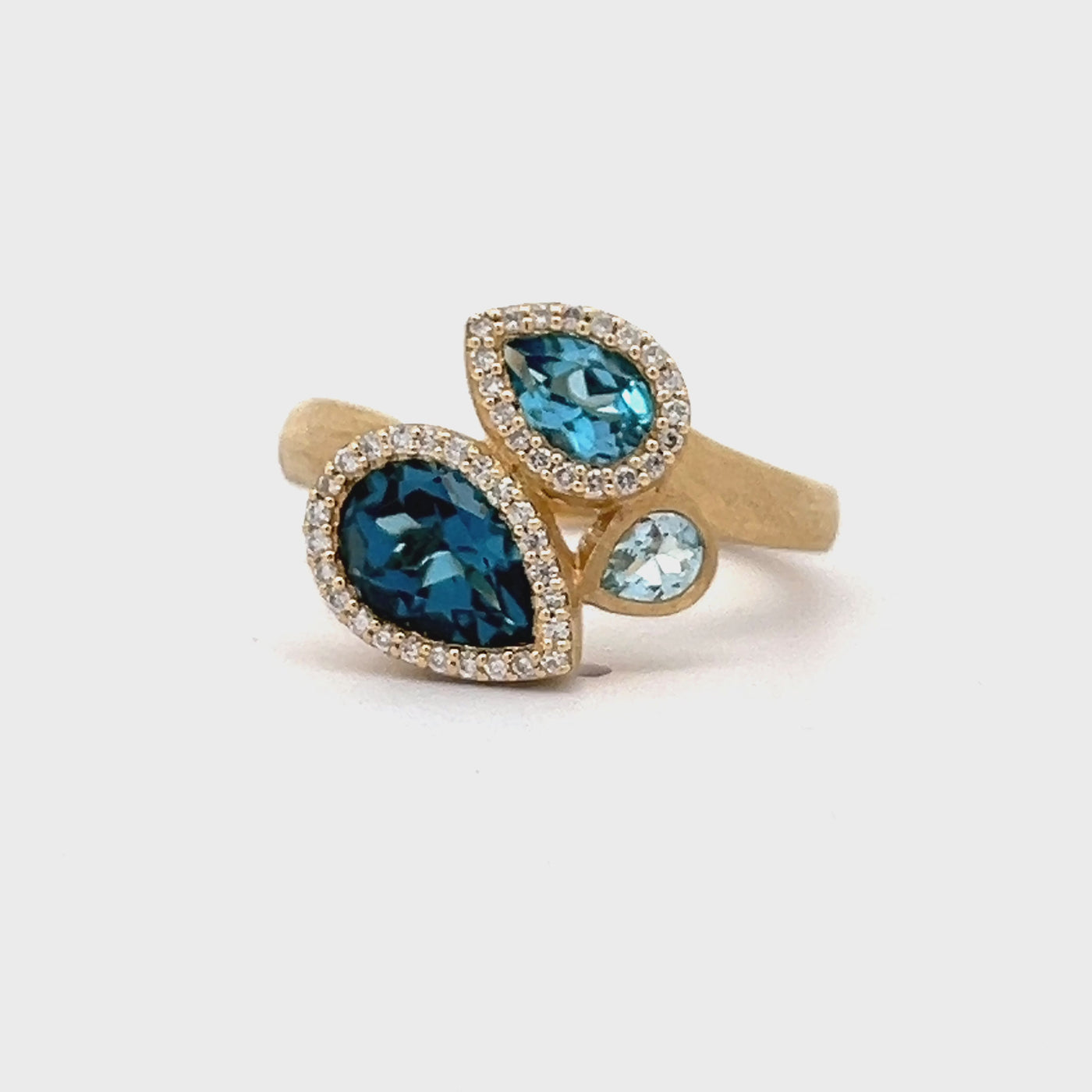 14k Yellow Gold Pear Shape Blue Topaz and Round Diamond Three Stone Halo Ring (1.96ctw.)