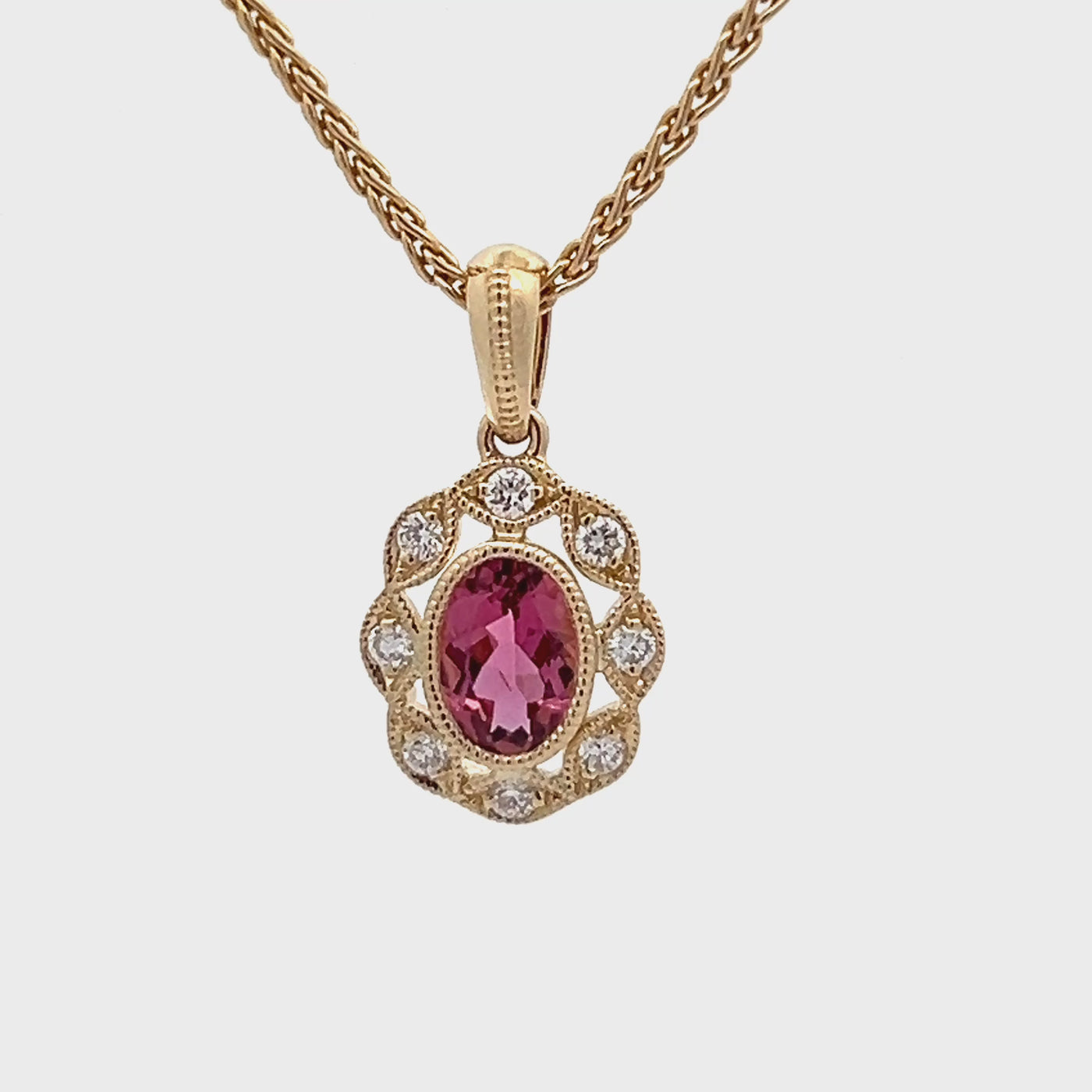 14k Yellow Gold Oval Pink Tourmaline and Round Diamond Halo Pendant (0.43ct.)